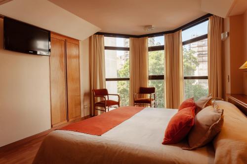 מיטה או מיטות בחדר ב-Primacy Apart Hotel