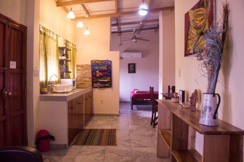 a kitchen with a counter and a table in a room at The Cottages by the Sea in San Clemente