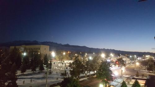 a view of a city at night with lights at Apartment in the Karakol heart in Karakol