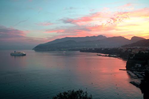 a view of a river with a cruise ship on it at Hotel La Tonnarella in Sorrento