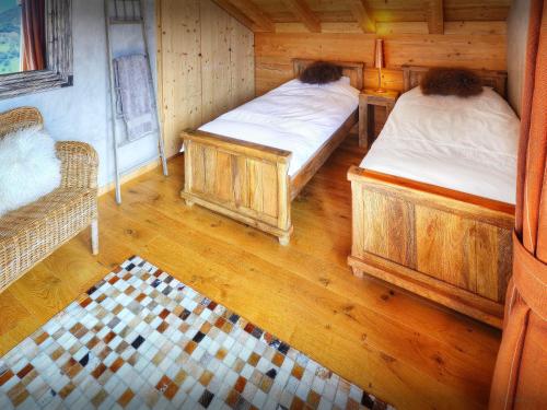 an overhead view of two beds in a room at Chocolat Manigod - OVO Network in Manigod