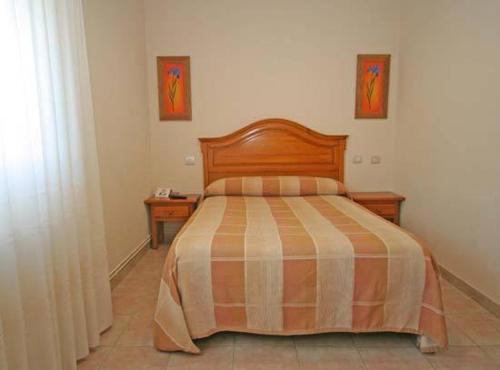 Cama o camas de una habitación en Hotel Ceao