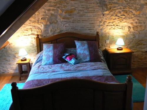 Llit o llits en una habitació de Le Manoir des Chapelles