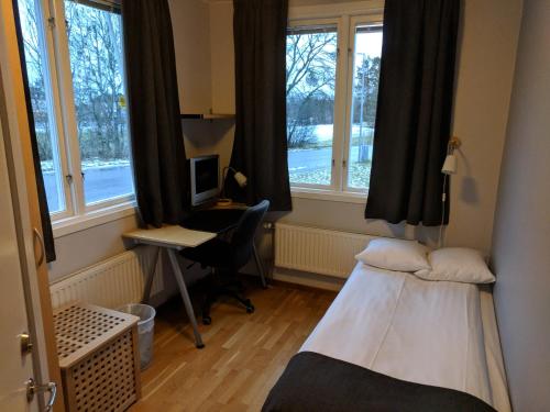 Postel nebo postele na pokoji v ubytování Hotell Hässlö