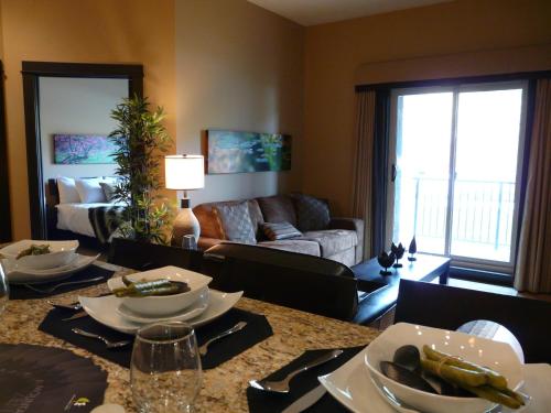 a living room with a dining table and a living room at Silver Creek Lodge in Canmore