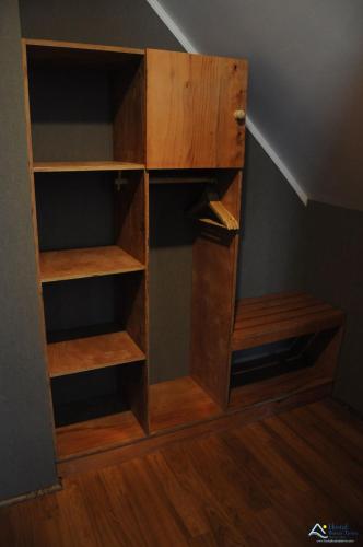 a book shelf in the corner of a room at Hostal Buena Tierra in Pucón