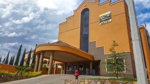 a church with a sign on the side of it at Hotel Don Ruben in Chihuahua