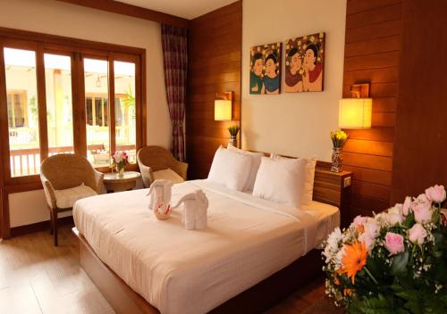 Кровать или кровати в номере Vieng Mantra Hotel