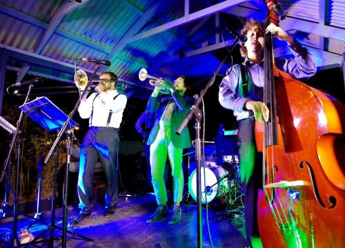 a group of people playing music on a stage at The Tamworth Hotel in Tamworth