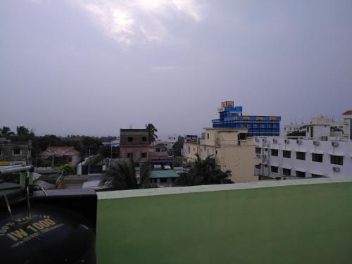 a view of a city with buildings in the background at Rehoboth Home Stay in Kanyakumari