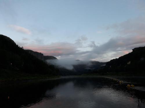 a river in the middle of a valley at Penzion Přívoz in Hřensko