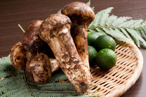 a basket of vegetables and limes on a table at Ito Yukitei in Ito