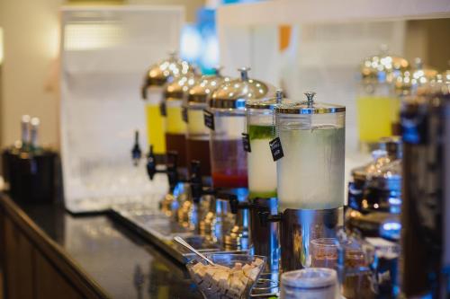 a bar with a bunch of different types of drinks at Napa Plaza Hotel (Adults Only) in Ayia Napa