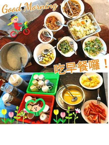 a table filled with dishes of food with writing on it at Tap Bed & Breakfast in Taitung City
