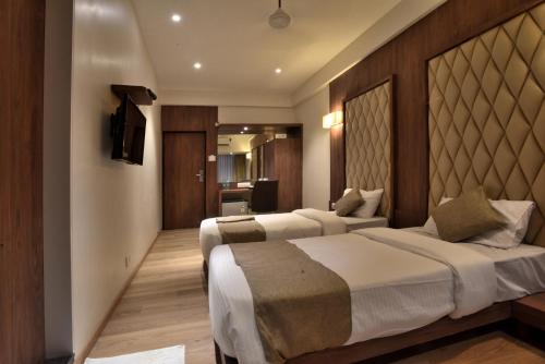 A bed or beds in a room at Rester Xpress Santacruz