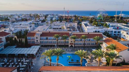 an aerial view of a city with palm trees and the ocean at Napa Plaza Hotel (Adults Only) in Ayia Napa