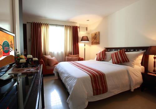Кровать или кровати в номере The Suites at Calle Nueva