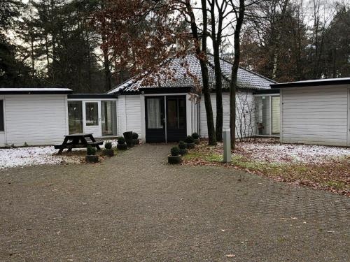 a house with a picnic table in front of it at Landgoed ISVW in Leusden