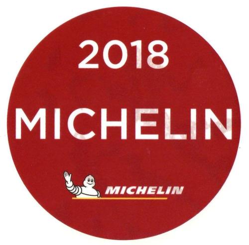 a red sign with the words michilimemia on it at Albergo Hotel Raffaello in Urbino