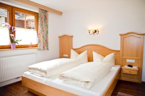 Кровать или кровати в номере Larchergut
