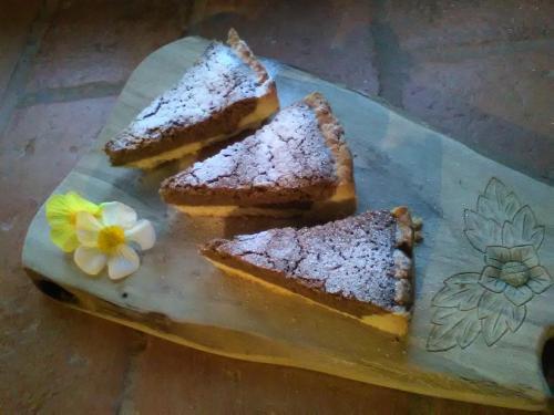 three slices of bread on a plate with a flower at B&B Santa Brigida in Santa Brigida