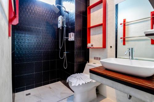 a bathroom with a sink and a toilet at S2 Residence in Ao Nang Beach