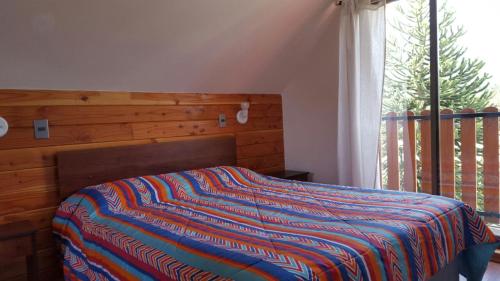 Postel nebo postele na pokoji v ubytování Casona Familiar Pucon Centro