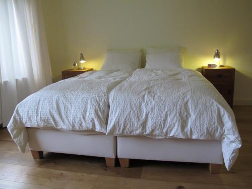 Tempat tidur dalam kamar di Bed and Breakfast Allure