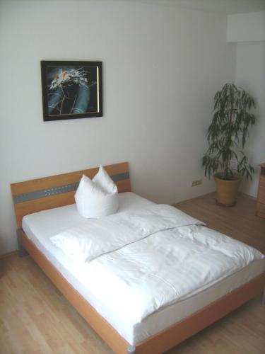 Ένα ή περισσότερα κρεβάτια σε δωμάτιο στο Hotel Reuterhof