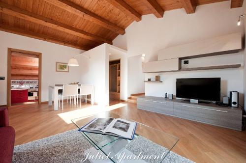 a living room with a large flat screen tv at Modica-Apartments in Modica