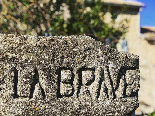 a stone sign with the wordarma written on it at Domaine de La Brave in Pernes-les-Fontaines