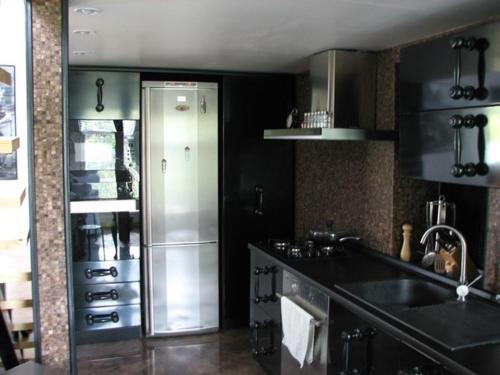 a kitchen with a stainless steel refrigerator in it at Чудо-Дом для Чудо-Людей in Plakhtyanka