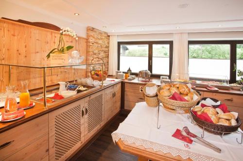 a kitchen with baskets of food on a table at Gasthof zum Wilden Kaiser in Scheffau am Wilden Kaiser