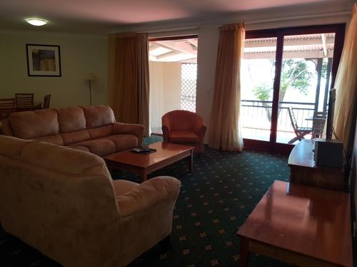 a living room with a couch and a table at Mayfield on Montville in Montville