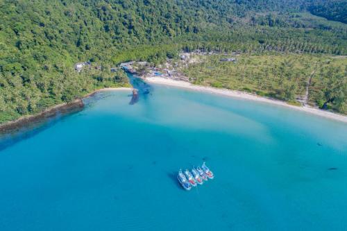 an aerial view of a boat in a large body of water at Rest Sea Resort Koh Kood in Ko Kood
