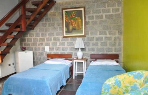 Postel nebo postele na pokoji v ubytování Quilombo Hotel Fazenda