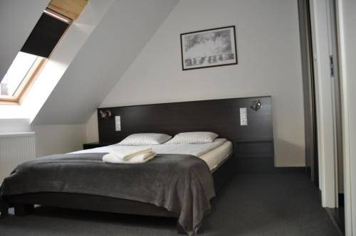 Postel nebo postele na pokoji v ubytování Apartamenty Przy Starówce
