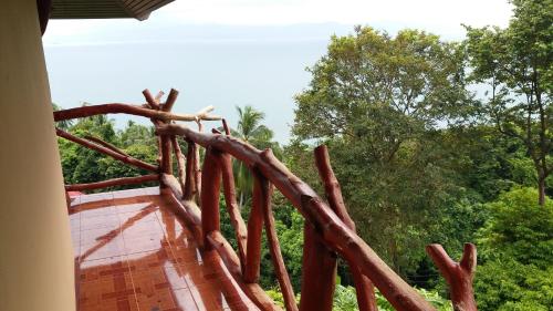 a group of tree branches on the side of a boat at Bang Son Golden View in Baan Khai