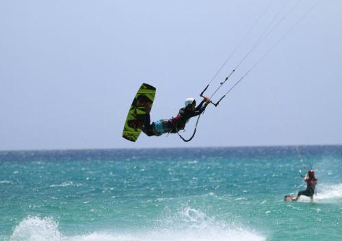a person on a kite board in the ocean at Your Ocean Suite in Costa Calma