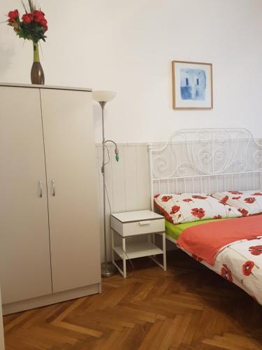 A bed or beds in a room at Valentina Guesthouse