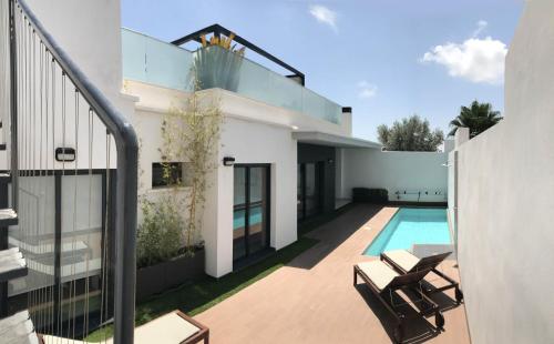 an image of a house with a swimming pool at Casa La Nao in Playas de Orihuela