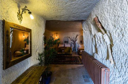 a hallway with a mirror and a living room at Elite Cave Suites in Goreme