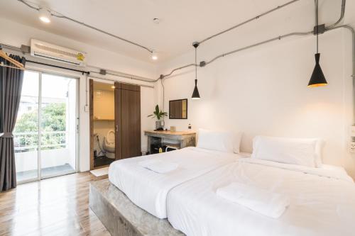 Ένα ή περισσότερα κρεβάτια σε δωμάτιο στο Your Space Hotel Prasingh