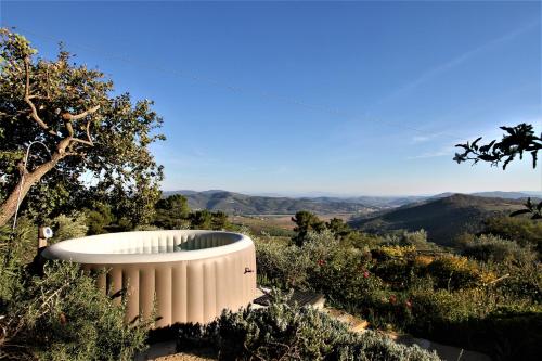 a building on top of a hill with trees at Villa La Moraiola in Passignano sul Trasimeno