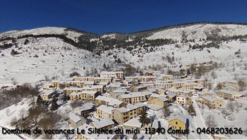 a village covered in snow on a mountain at Le Silence du Midi in Comus