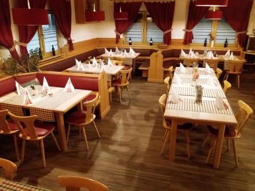 
a restaurant with tables and chairs in it at Gasthof Falter in Straubing
