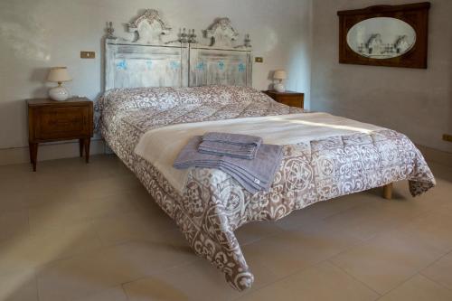 Posteľ alebo postele v izbe v ubytovaní B&B LELLA