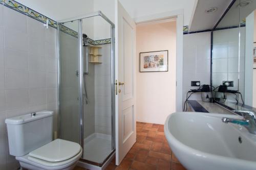 a bathroom with a shower and a toilet and a sink at Rosa Dei Venti in Lipari