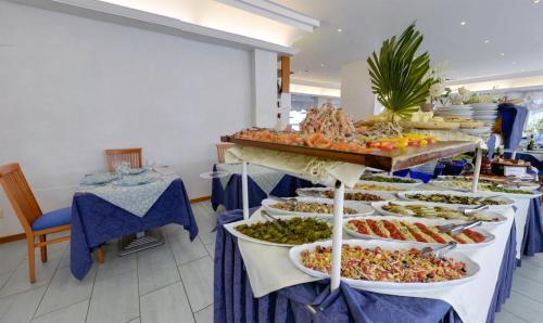 a buffet line with many different types of food at Hotel Margareth in Riccione
