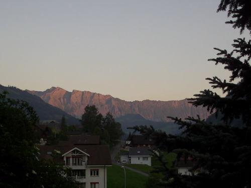 a view of a town with mountains in the background at Apartmenthaus Kreuzbuche in Flühli